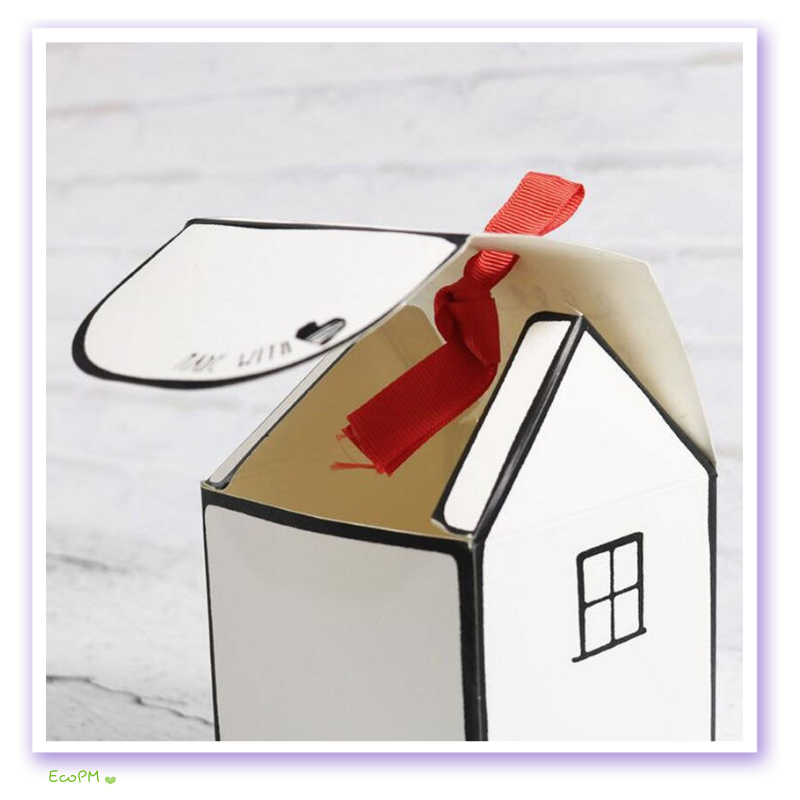 artisanal-favor-box-with-red-ribbon-detail.png Close-up of a handcrafted favor box with a red ribbon, highlighting its bespoke charm and attention to detail.