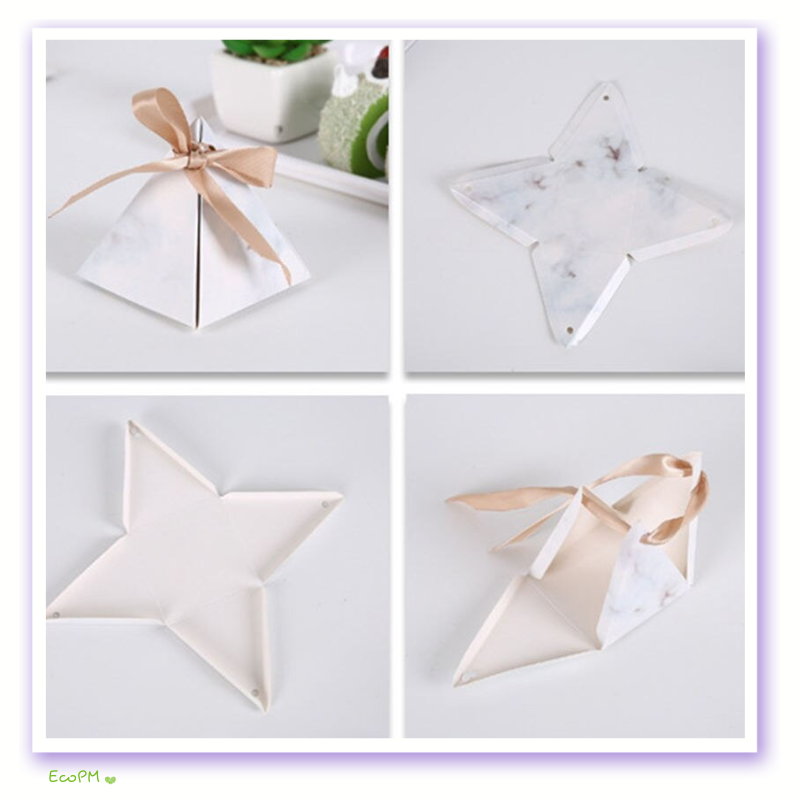 elegant-pyramid-favor-box-marble-solid-set.jpg A collection of pyramid-shaped favor boxes with marble patterns and solid colors, adorned with satin ribbons, perfect for stylish event gifting.