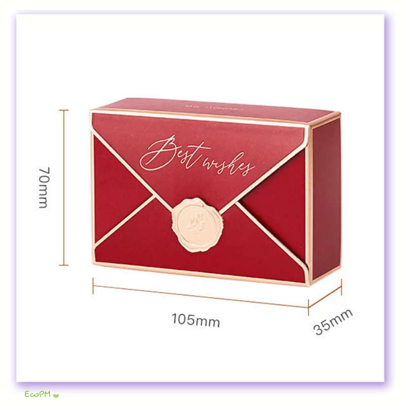 elegant-wishes-red-favor-box-set.png Luxurious red favor box with gold lettering and white seal, dimensions 105mm by 70mm by 35mm.