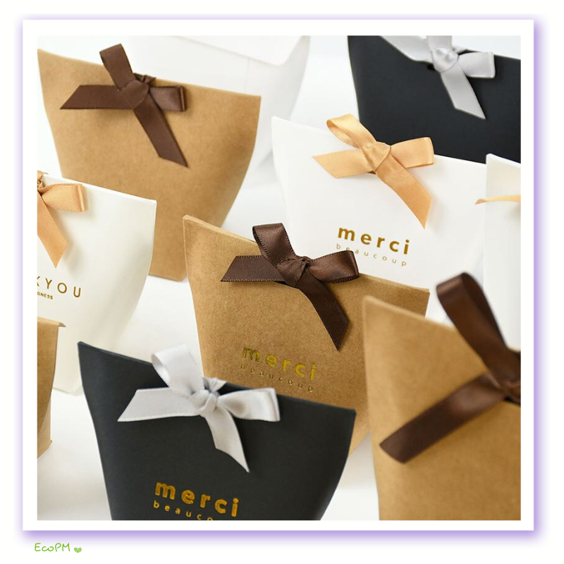 gratitude-favor-boxes-assorted-set.jpg Assorted 'Thank You' and 'Merci Beaucoup' favor boxes with satin ribbons, perfect for expressing gratitude at events.