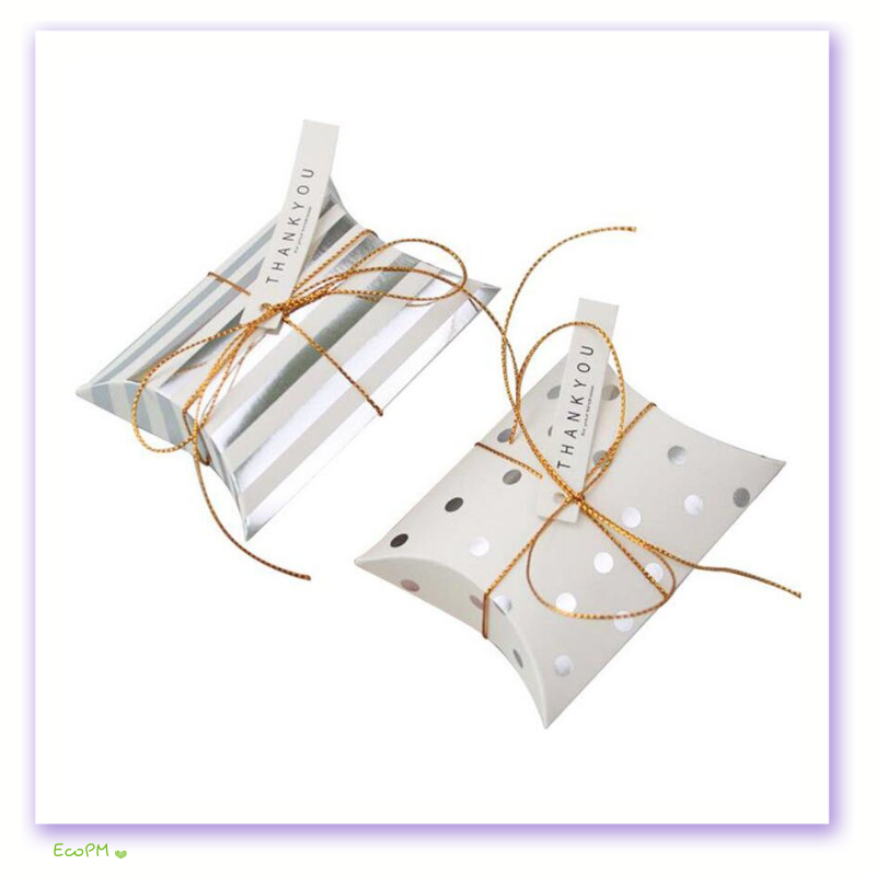 elegant-striped-polka-dot-thank-you-favor-boxes.png Two favor boxes with golden stripes and polka dot patterns tied with a golden string and a 'Thank You' tag.