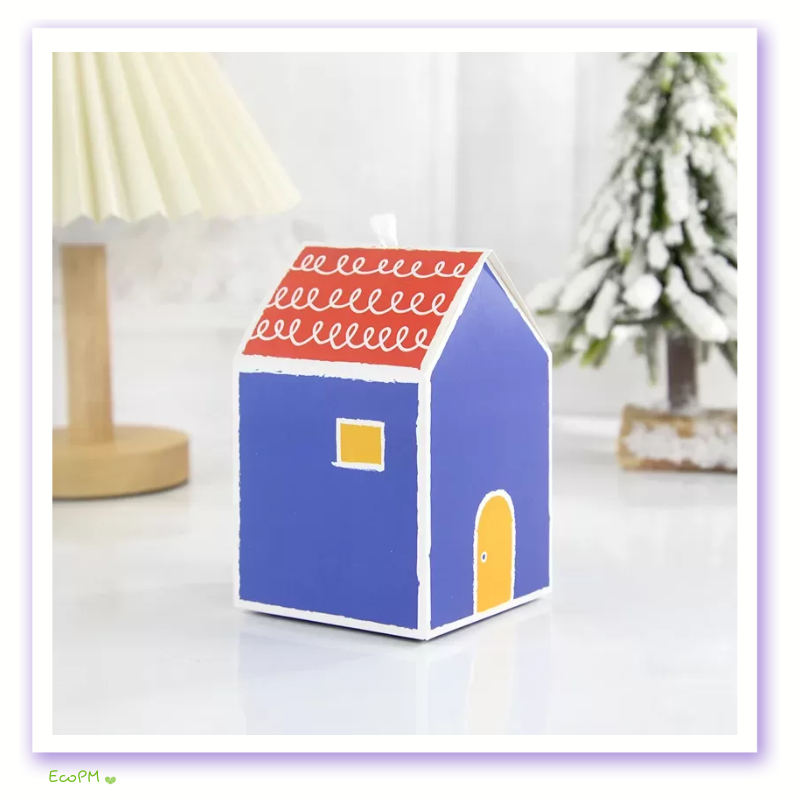 royal-blue-abode-favor-box.png A royal blue miniature house favor box with an orange scalloped roof and yellow window accents.