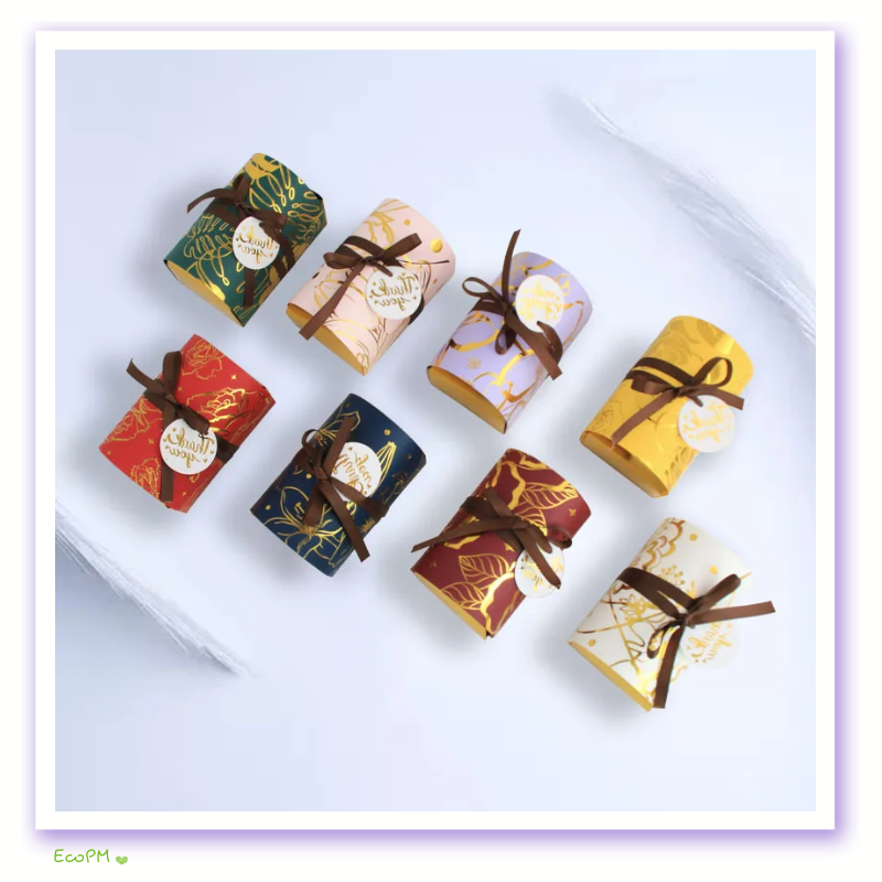 assorted-golden-gratitude-floral-favor-boxes.png Assorted collection of Golden Gratitude Floral Favor Boxes with elegant botanical designs and thank you tags.