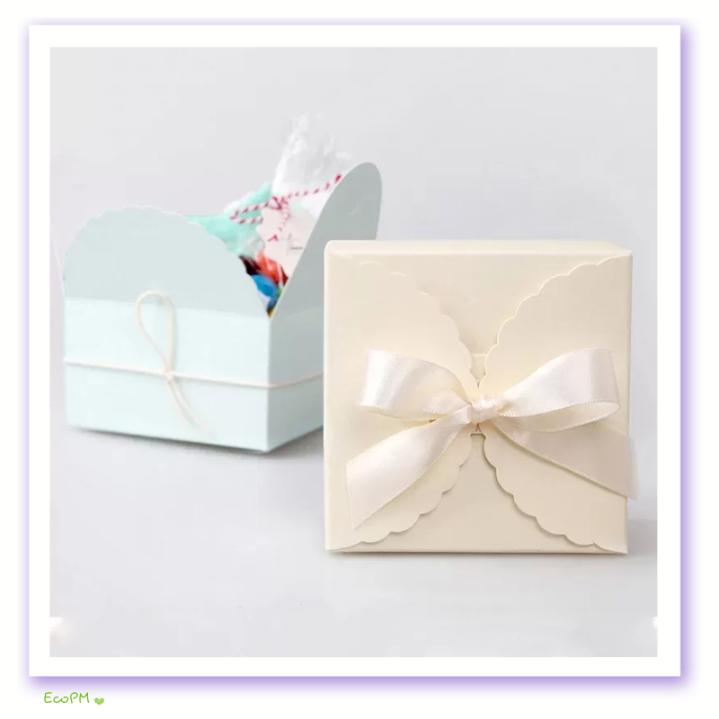 blush-yellow and blue elegance-satin-ribbon-favor-box.png Elegant blush favor box with scalloped edges and satin ribbon on a light background.