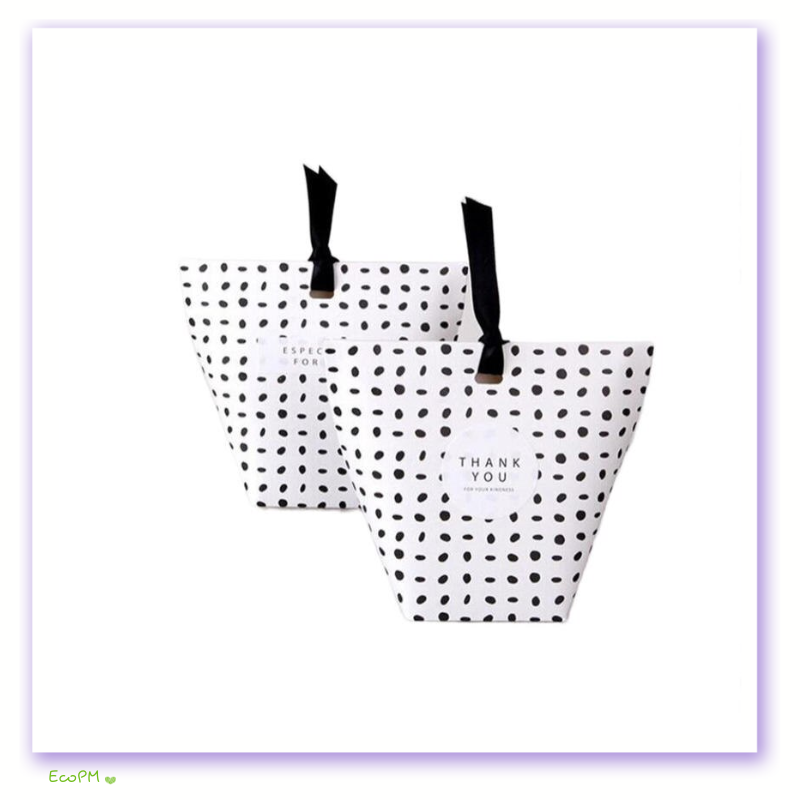 classic-polka-dot-favor-boxes-black-ribbon.png Chic black and white polka dot favor boxes with elegant black ribbons and a 'Thank You' tag.