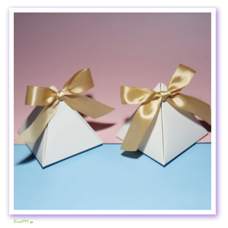 elegant-pyramid-gift-boxes-with-gold-ribbons.png Elegant white pyramid gift boxes tied with gold satin ribbons on a pastel pink and blue background