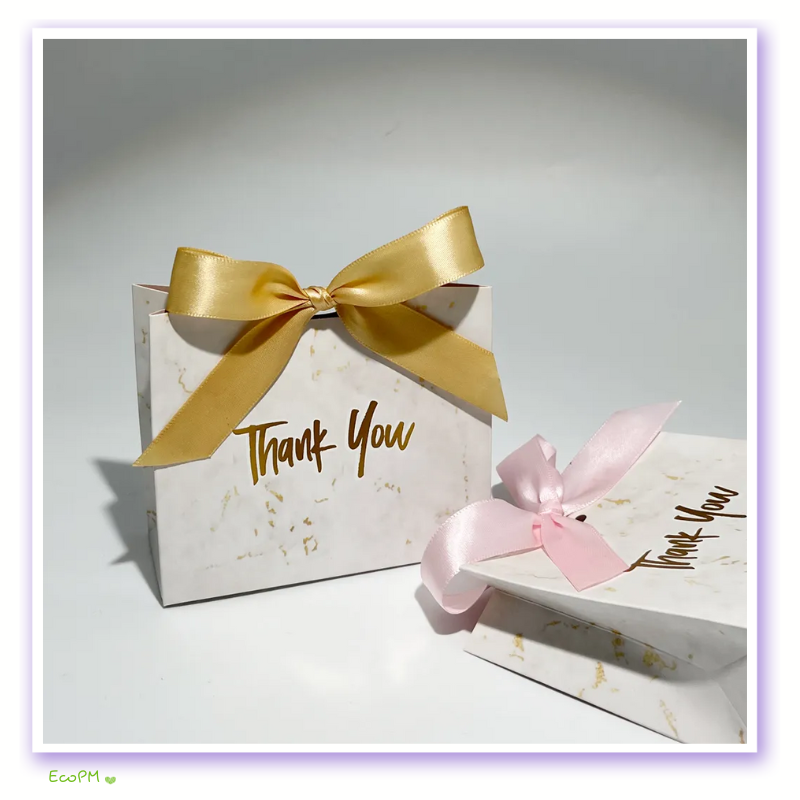 golden-elegance-thank-you-gift-box.png Elegant gift box with golden satin ribbon and 'Thank You' inscription against a minimalist background.