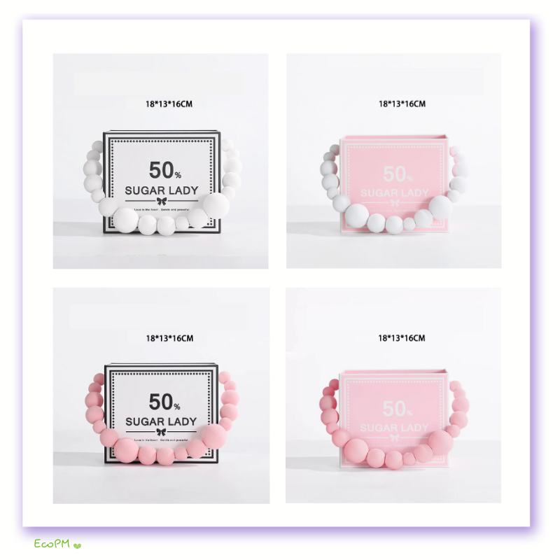 beaded-flower-box-collection.png Collection of white and pink beaded flower boxes by Sugar Lady, available in various colors, showcasing a playful and elegant design for gifting flowers