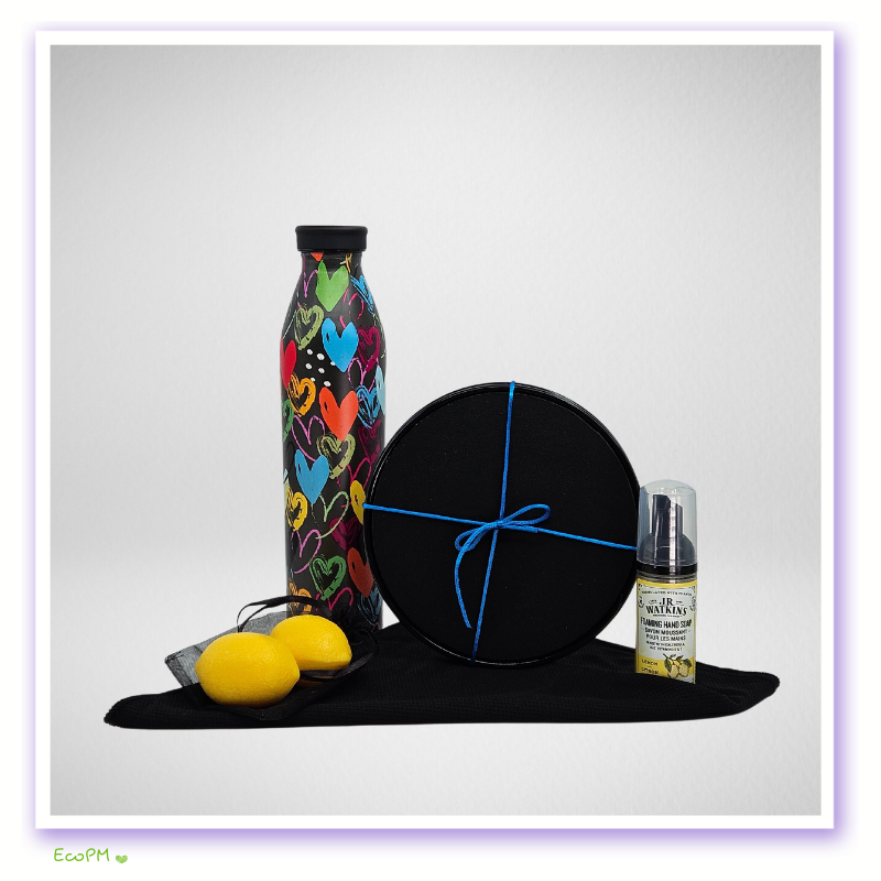 colorful-water-bottle-exercise-discs.jpg Colorful heart-patterned reusable water bottle with organic balms and lemons.