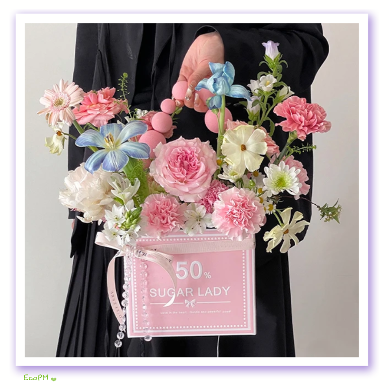 elegant-pink-flower-box-fashion.png Person holding a chic pink