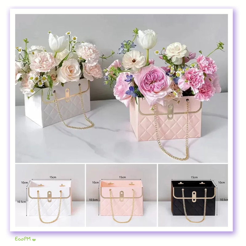 pastel-perfection-flower-box-collection.png Elegant flower boxes in white and pink with golden chain handles, filled with a delicate array of white tulips and pastel roses.