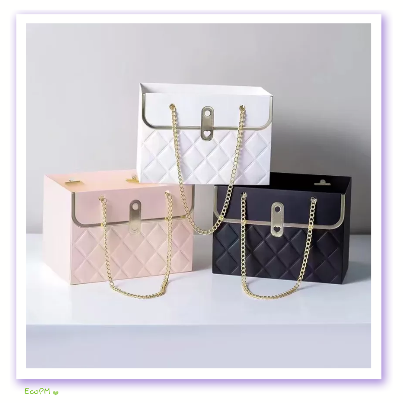 quilted-elegance-flower-box-collection.png Quilted design flower boxes in black, white, and pink with gold chain handles.