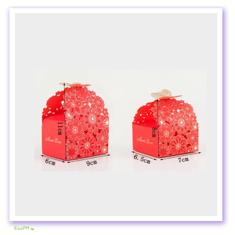 vibrant-red-floral-cut-out-favor-boxes.png Vibrant red favor boxes with floral laser-cut design and delicate butterfly clasps, perfect for festive occasions.