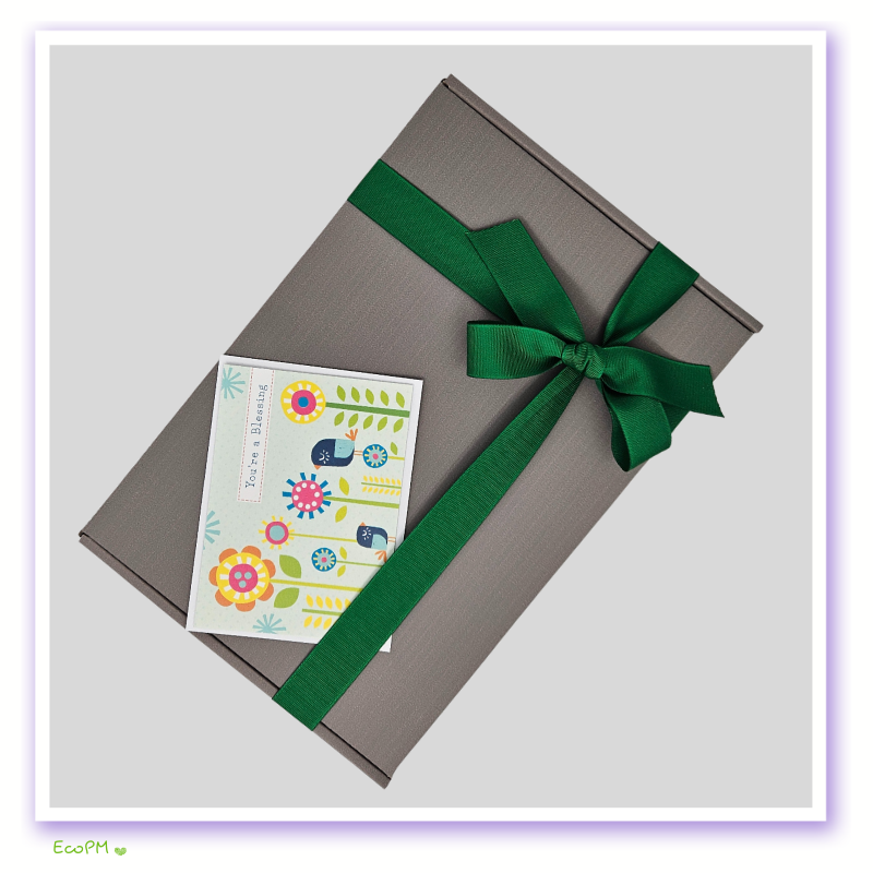 Gray-Gift-Box-with-Card-Ecopartymarket.png Elegant gray gift box tied with a green ribbon and a cheerful greeting card.