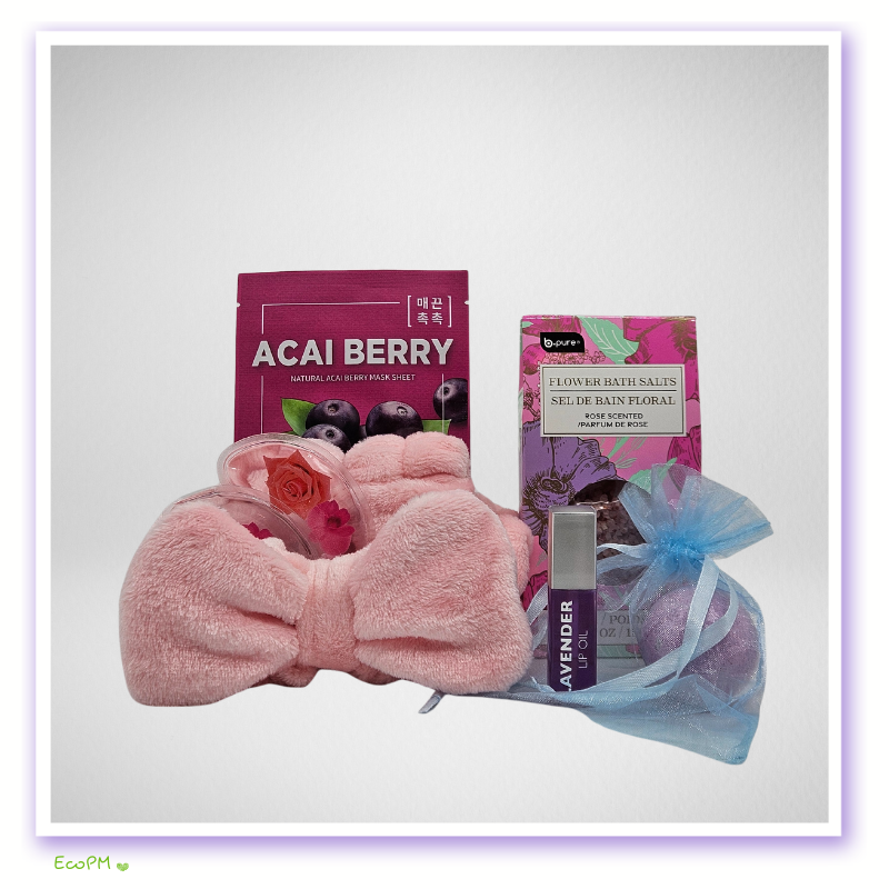 compact-beauty-gift-set-pink-headband.jpg Acai berry face mask and floral bath salts with lavender essential oil on pink fabric.