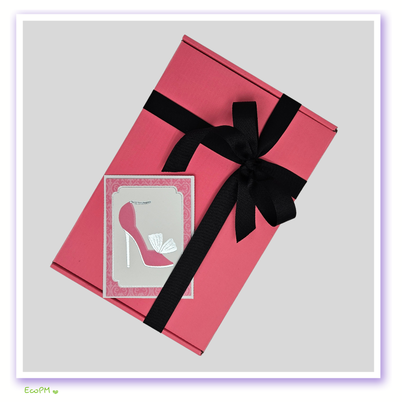 elegant-pink-bliss-gift-box-closed.png Closed Elegant Pink Bliss Gift Box with black ribbon.