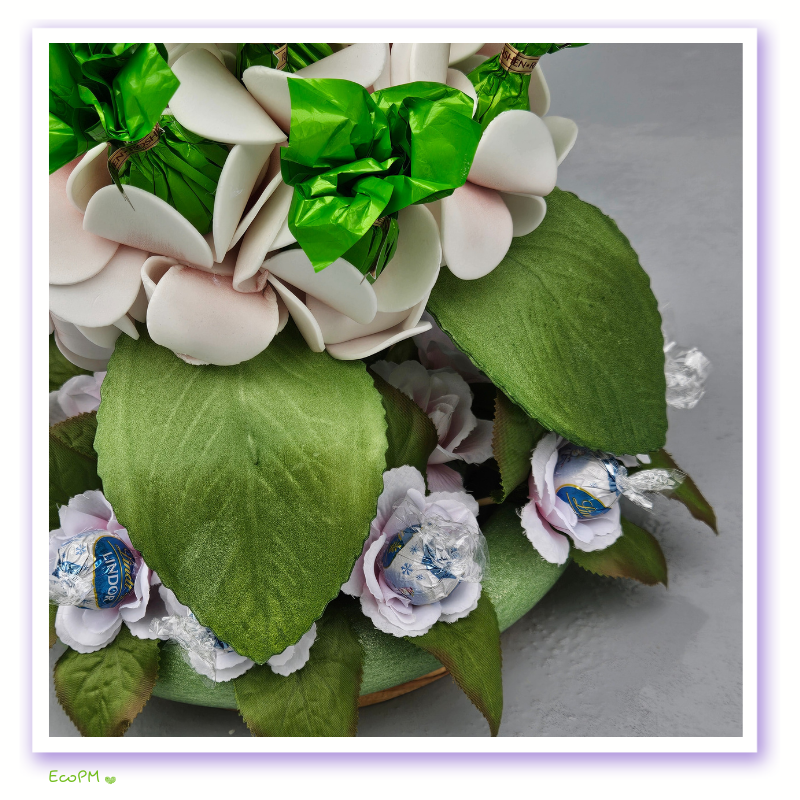 garden-delight-chocolate-bouquet-detail.jpg Detailed view of the Garden Delight Chocolate Bouquet with premium chocolates and decorative leaves.