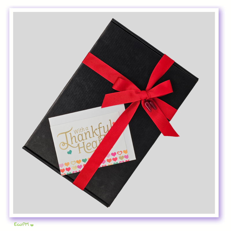 gourmet-cooking-essentials-gift-box.jpg Elegant black gift box with red ribbon and thank you card