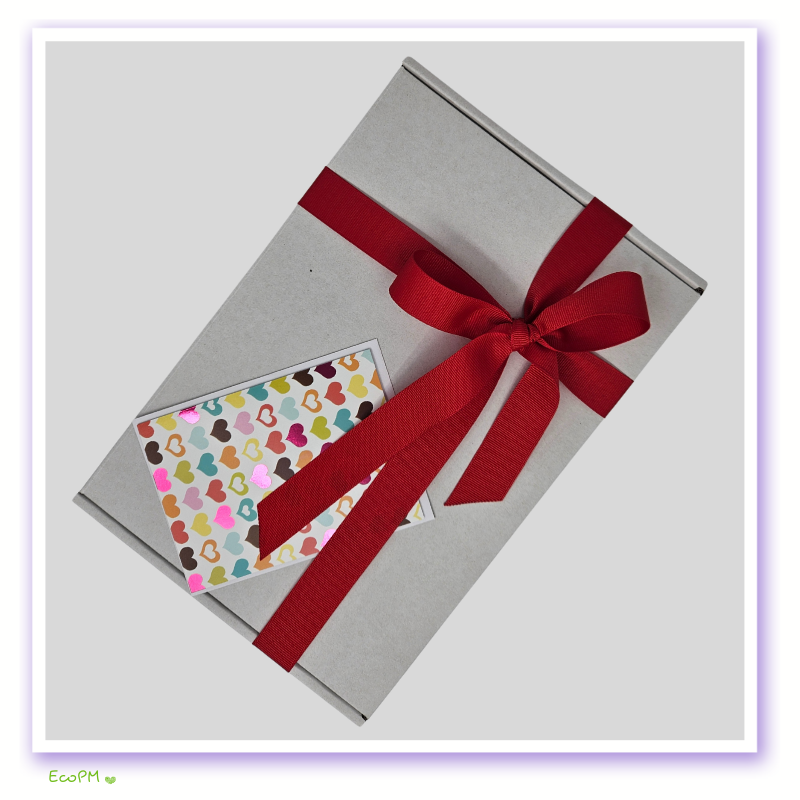 minimalist-gift-box-with-card.jpg Elegant grey gift box with red ribbon and colorful heart card.
