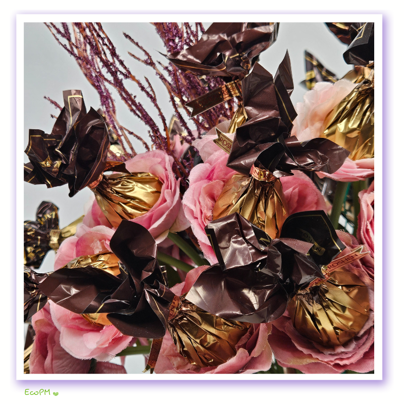 Close-up of chocolates and silk roses in the Rosy Elegance Chocolate Bouquet Rosy Elegance Chocolate Bouquet Closeup.png