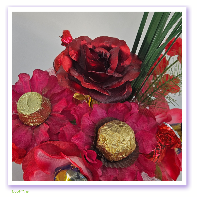 ruby-romance-chocolate-arrangement-flowers Detailed view of flowers and chocolates in the Ruby Romance Chocolate Arrangement