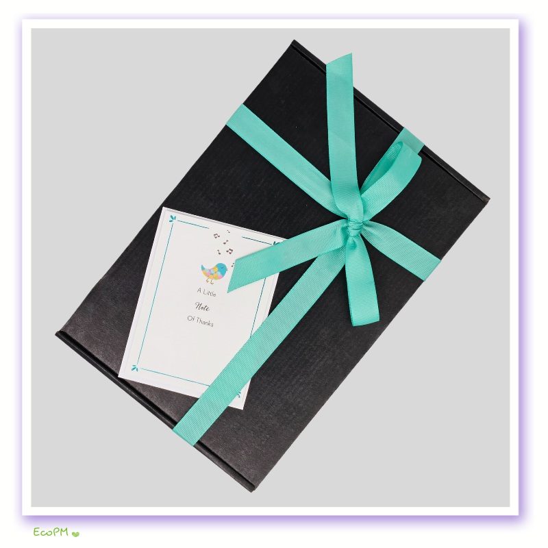 simple-elegance-gift-box-closed.jpg Elegant closed gift box with card and green ribbon