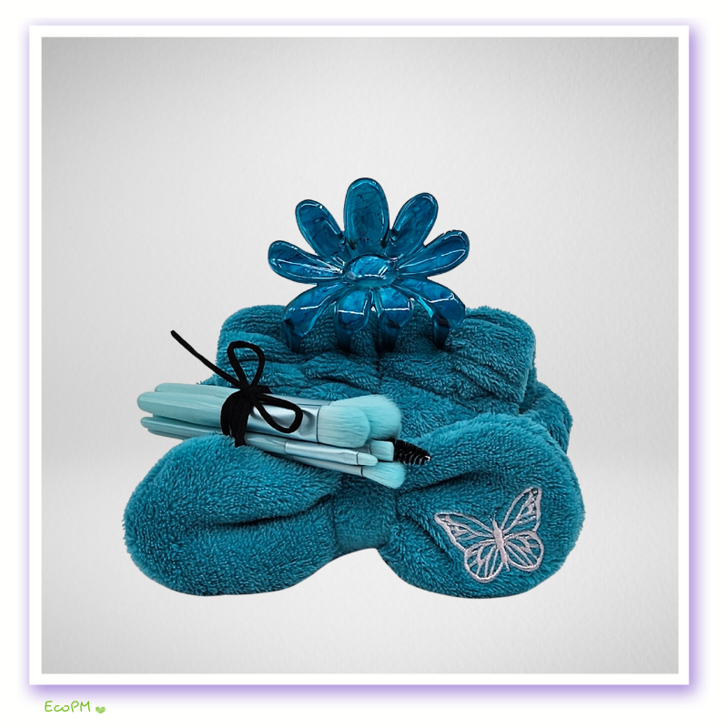 soothing-azure-collection-spa-accessories.jpg Turquoise spa accessories set with brushes and butterfly-themed decor.