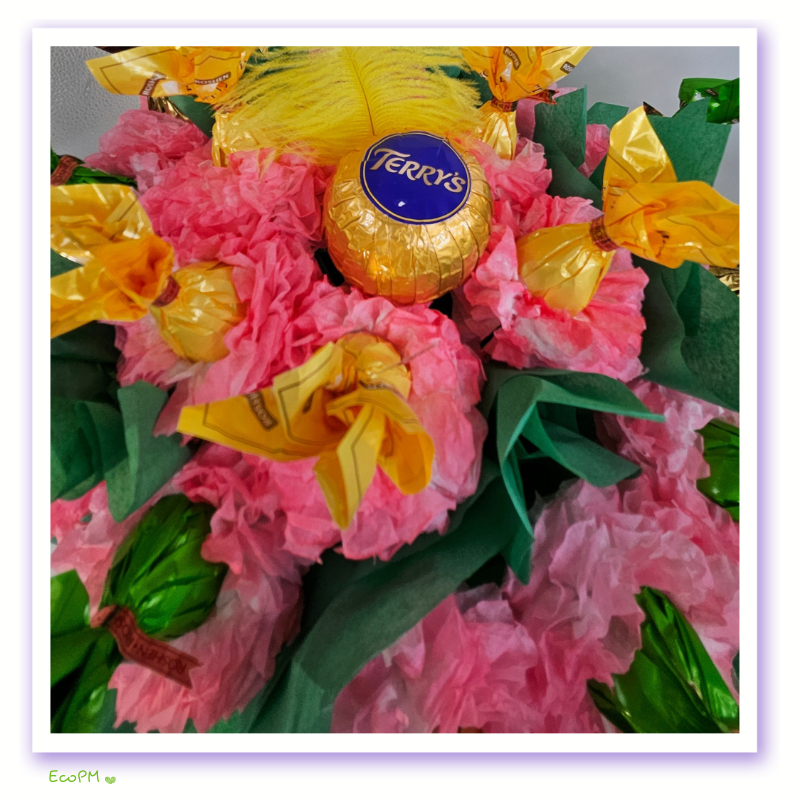 spring-delight-chocolate-bouquet-closeup.png Close-up of chocolates and tissue flowers in the Spring Delight Chocolate Bouquet