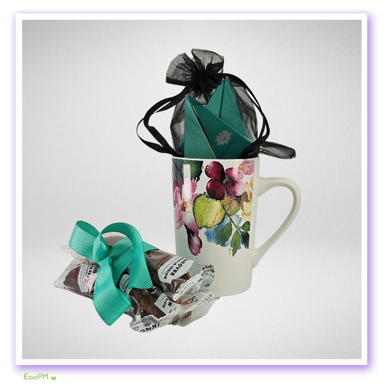 tea-cup-and-biscotti-treats.jpg Floral mug with organic treats and a green tea gift box on a white background.