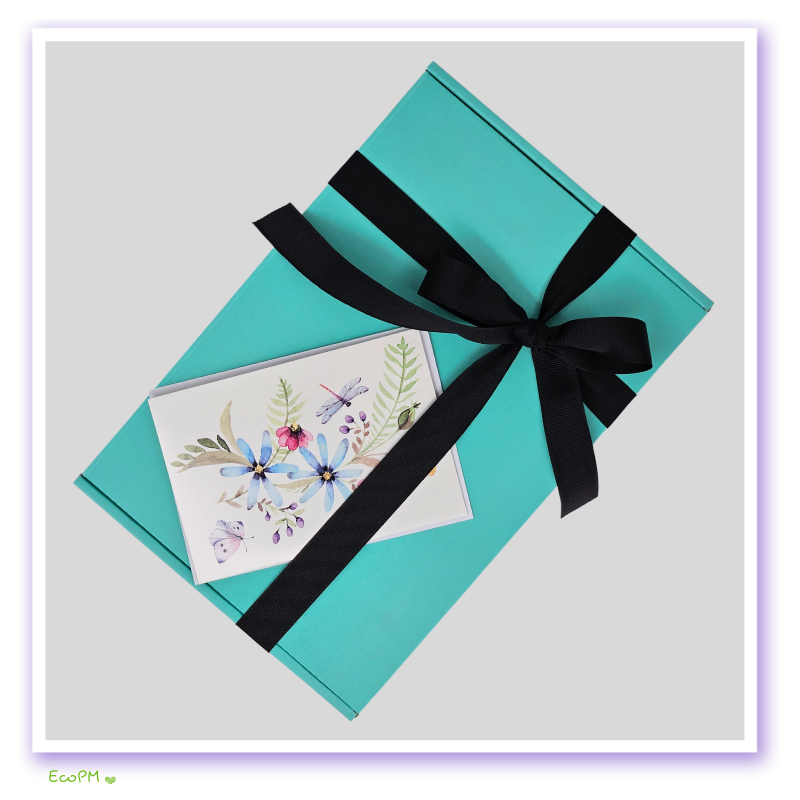 turquoise-tranquility-box-closed.jpg Closed turquoise gift box with floral greeting card.