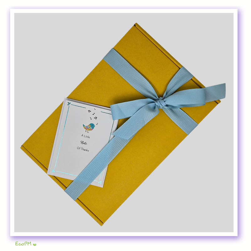 yellow-gift-box-note-of-thanks.jpg Yellow gift box with a note of thanks and summer-themed accessories.