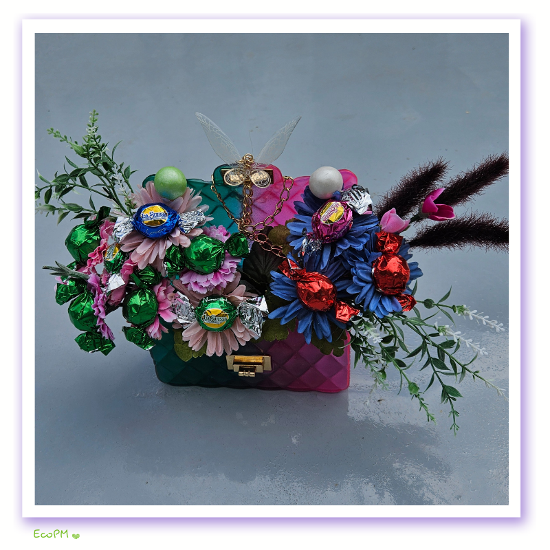 eco-party-floral-chocolate-bag-2.png Front view of colorful eco-friendly floral bag with chocolates