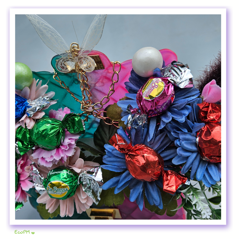 eco-party-floral-chocolate-bag-4.png Close-up of flowers and chocolates on eco-friendly floral bag